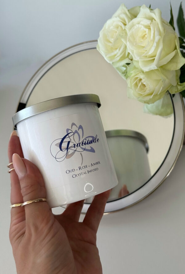 Gratitude Intention Candle with roses in mirror